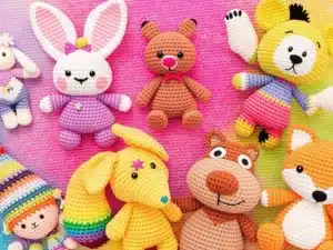 Colorful crochet animals including a bunny, bear, and fox.