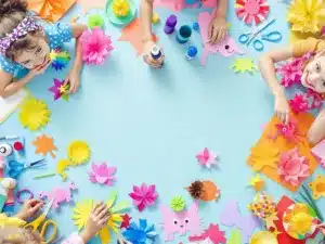 Children crafting colorful paper projects with joy and creativity.