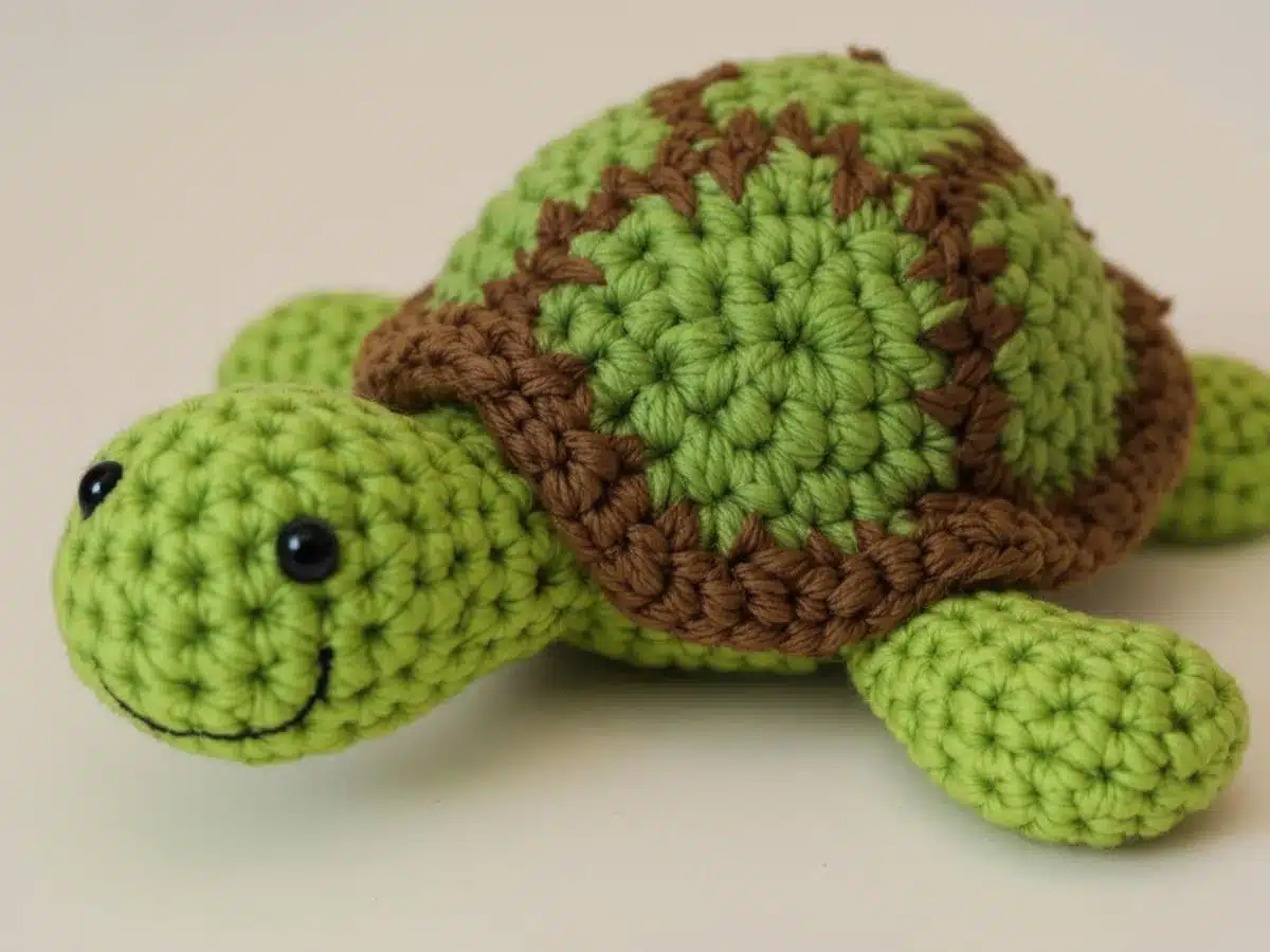 Colorful crochet turtle with intricate details and friendly expression.